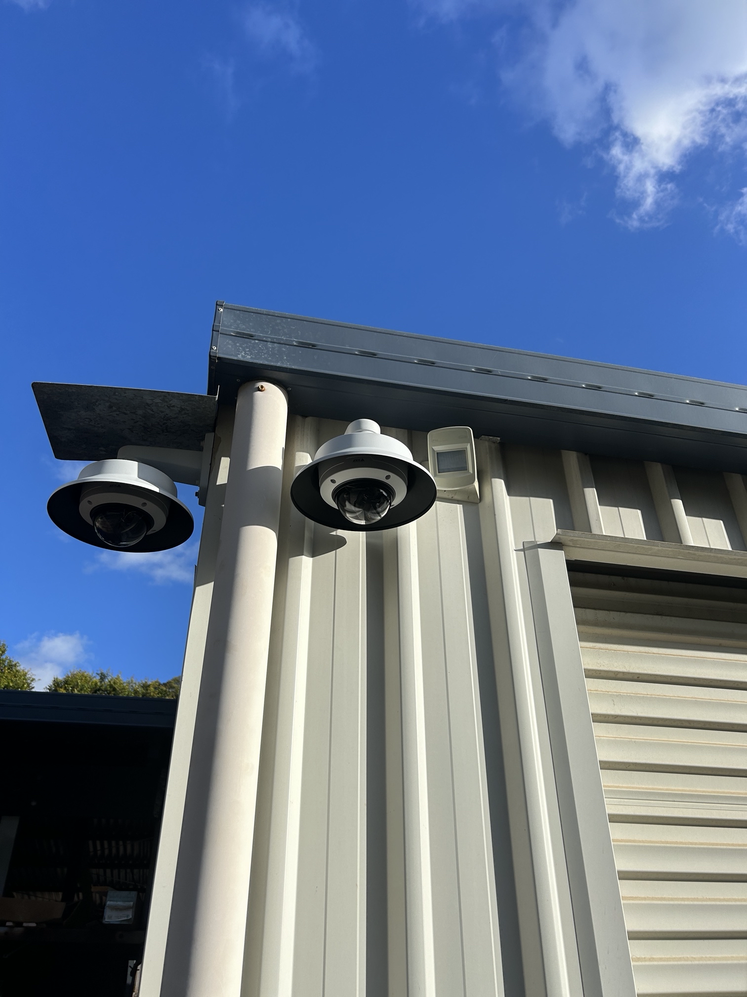 Exterior dome cameras installed on a commercial building